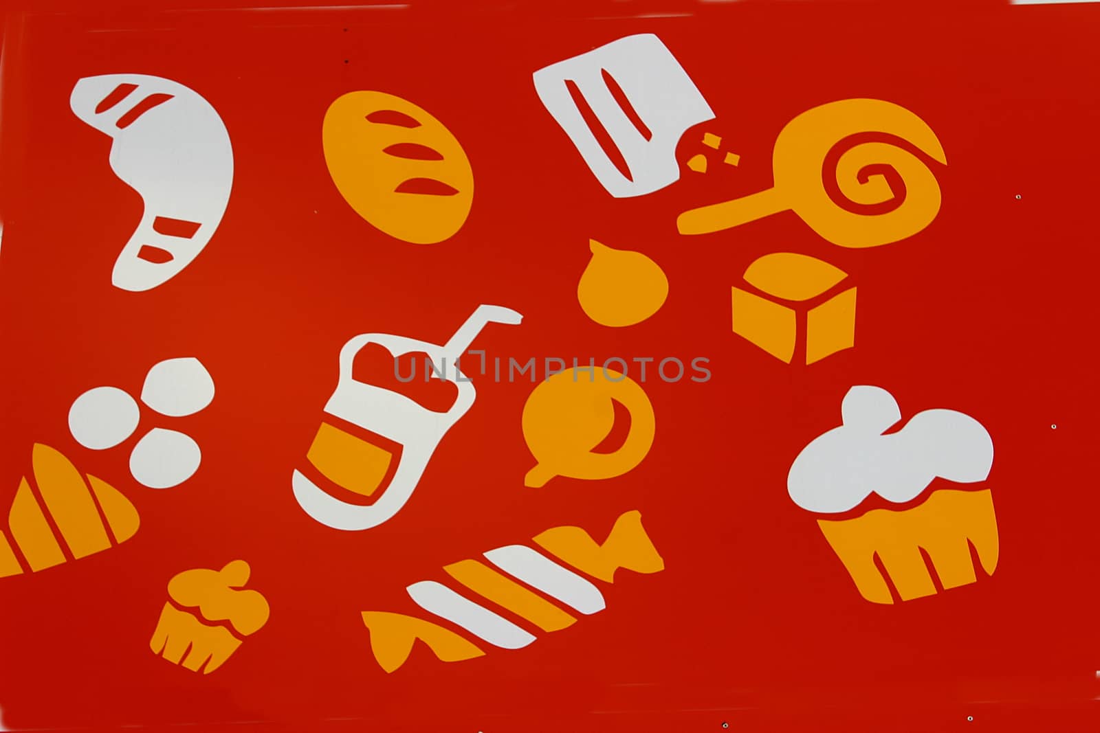 On an orange background drawings of various confectionery