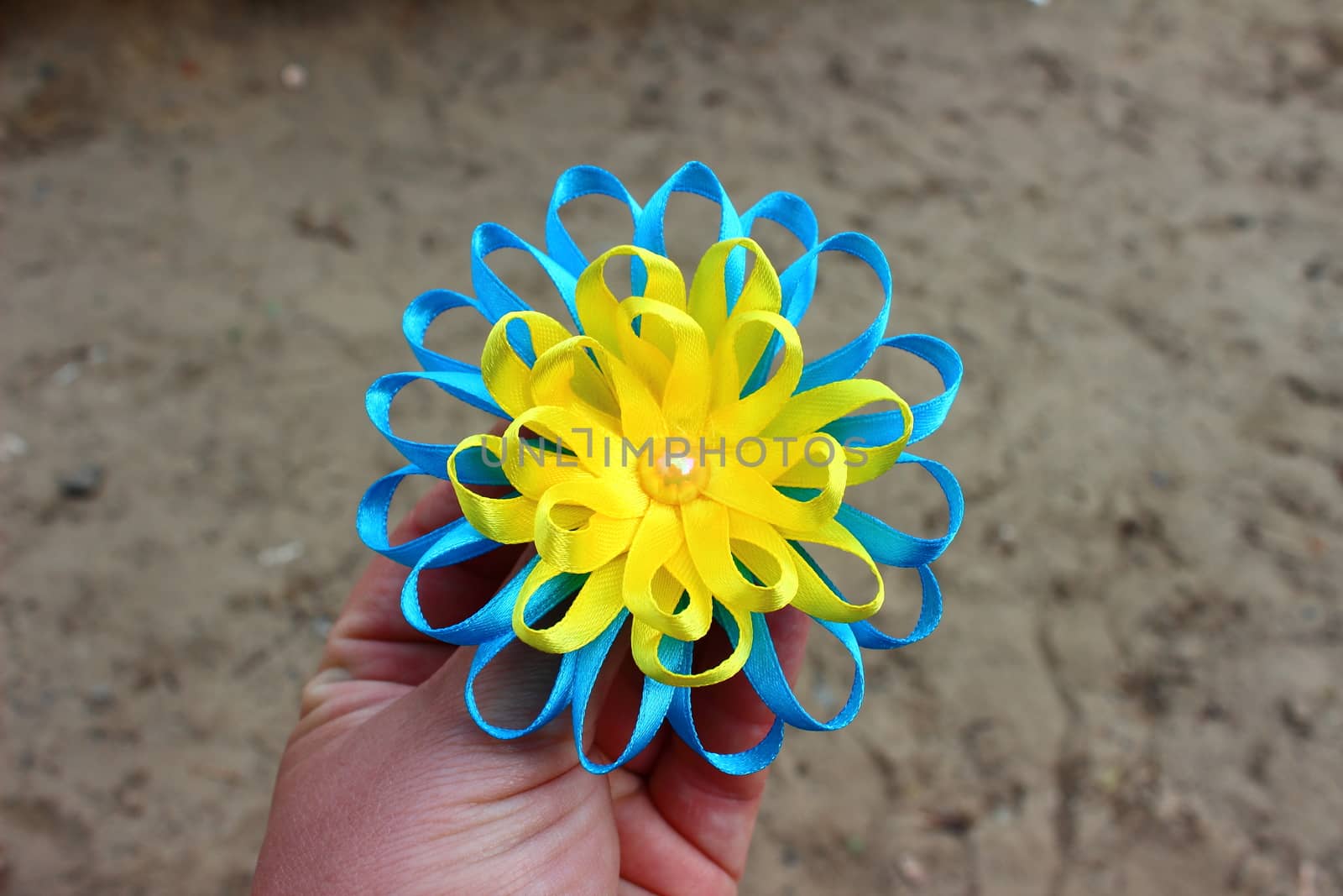 flower of yellow and blue ribbons with bead handmade