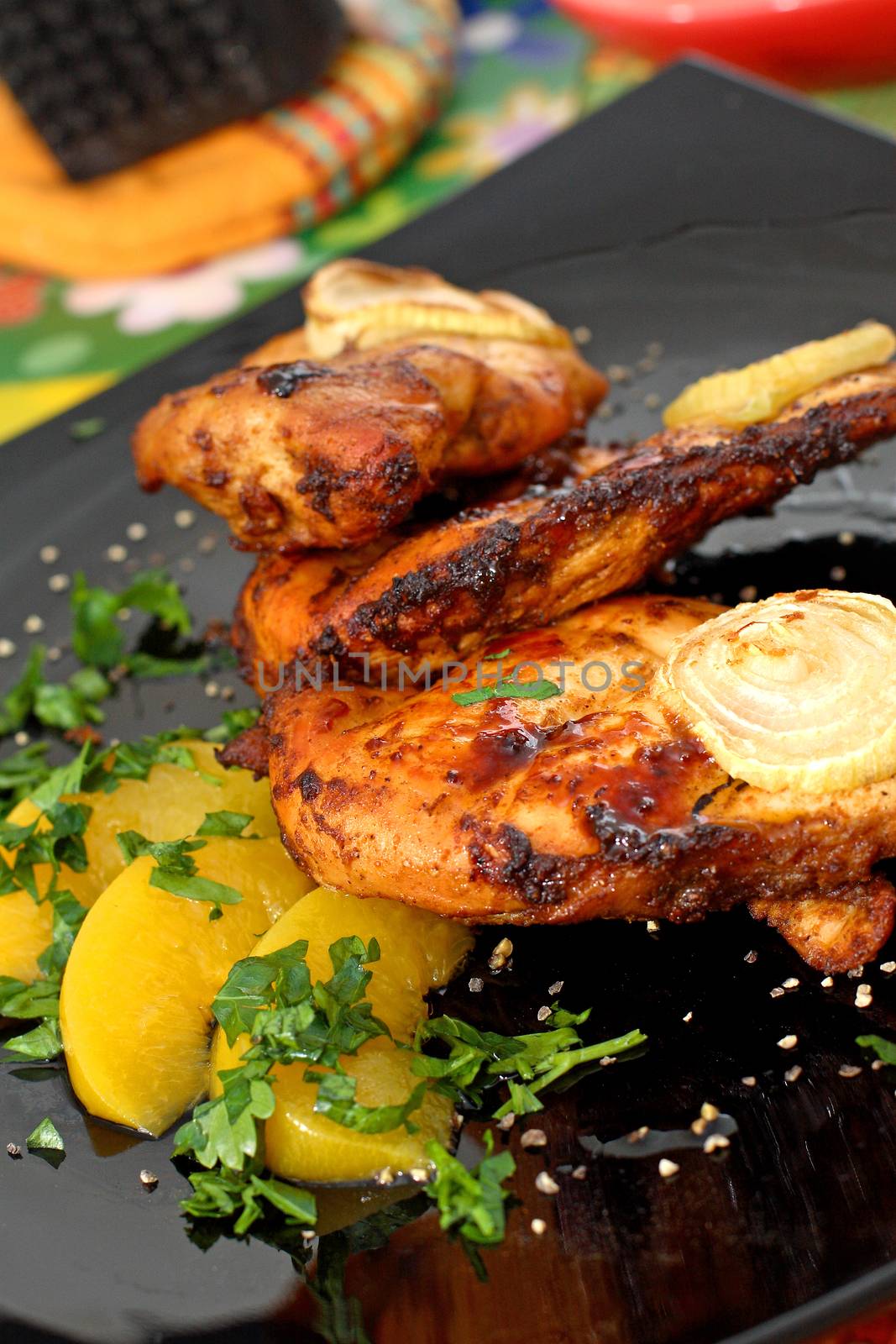 Colourful composition table - grilled chicken. Serving grilled poultry meat served on white ceramic plate