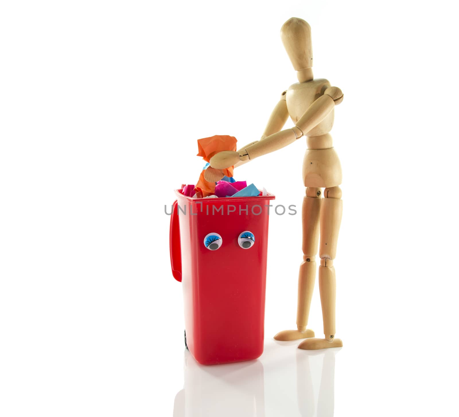wooden puppet with garbage bin container by compuinfoto