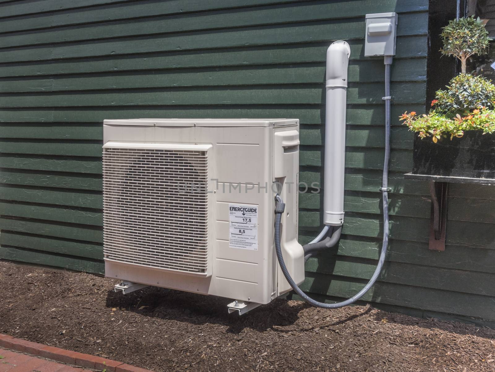 Small outdoor hvac unit outside a small store