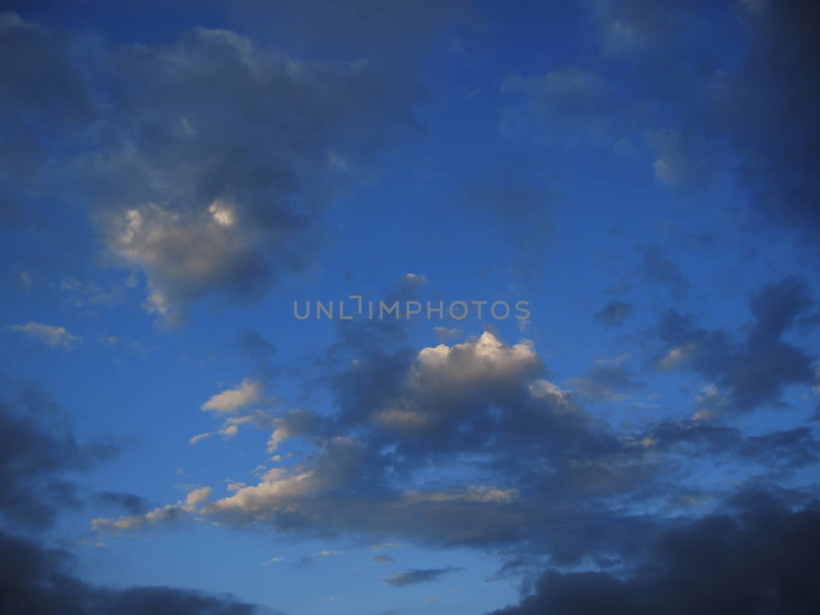 Blue sky and white clouds and the sun