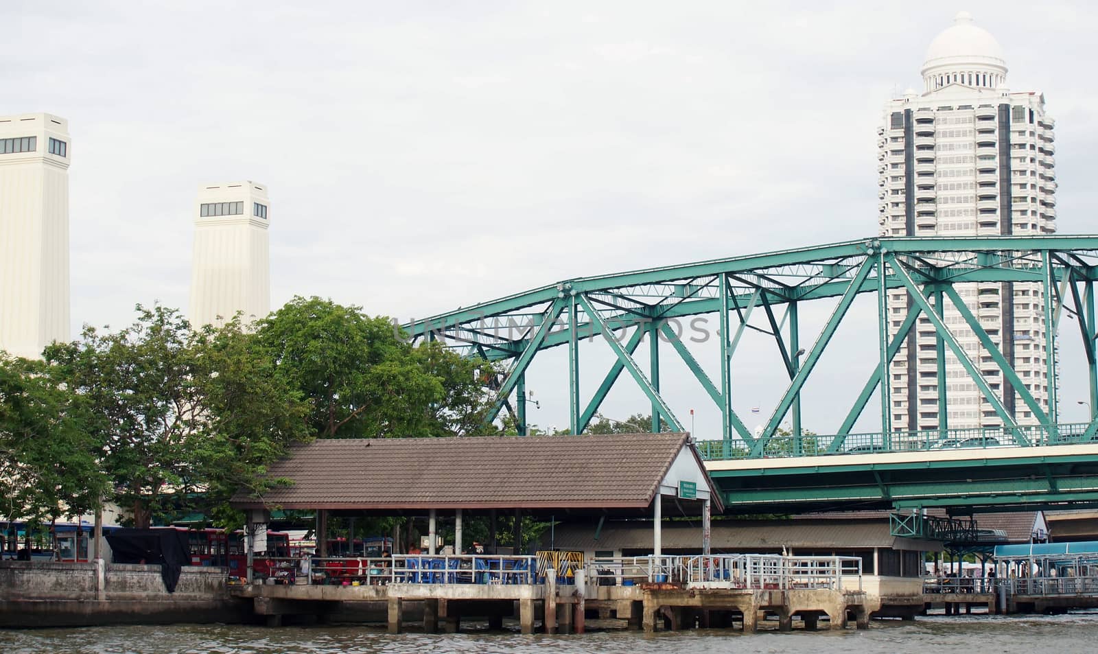 Green steel bridge built to cross the river on both sides in Thailand's capital.                              