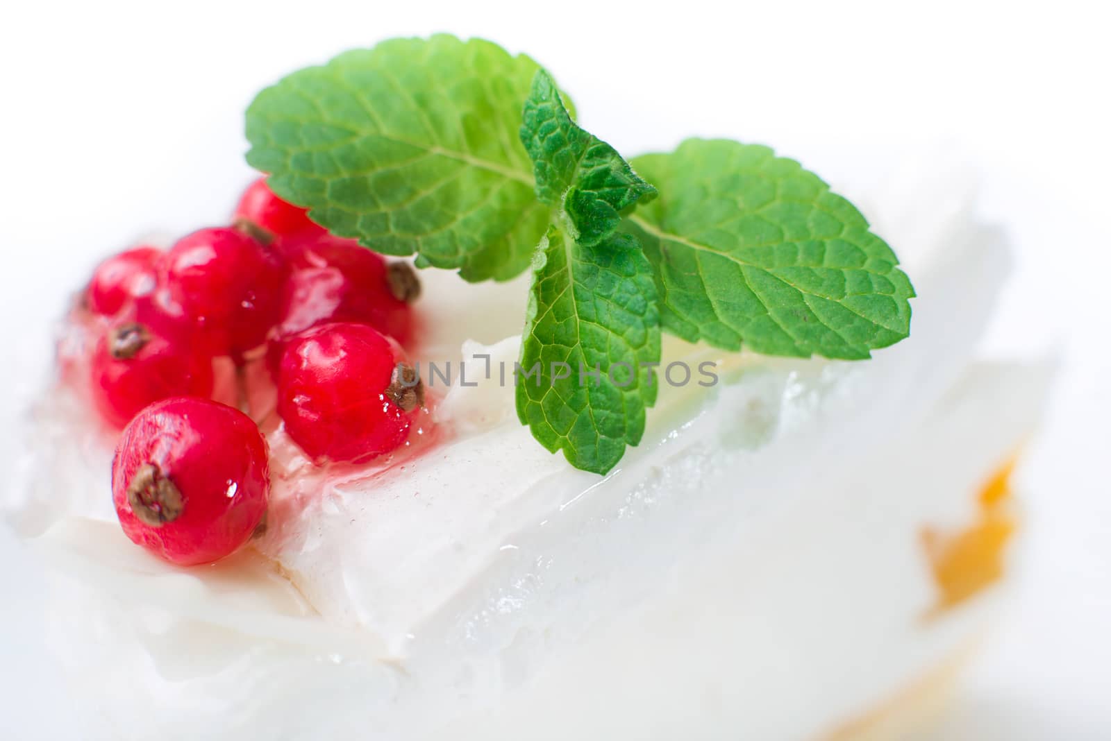 cheesecake with berries red currant and mint leaves