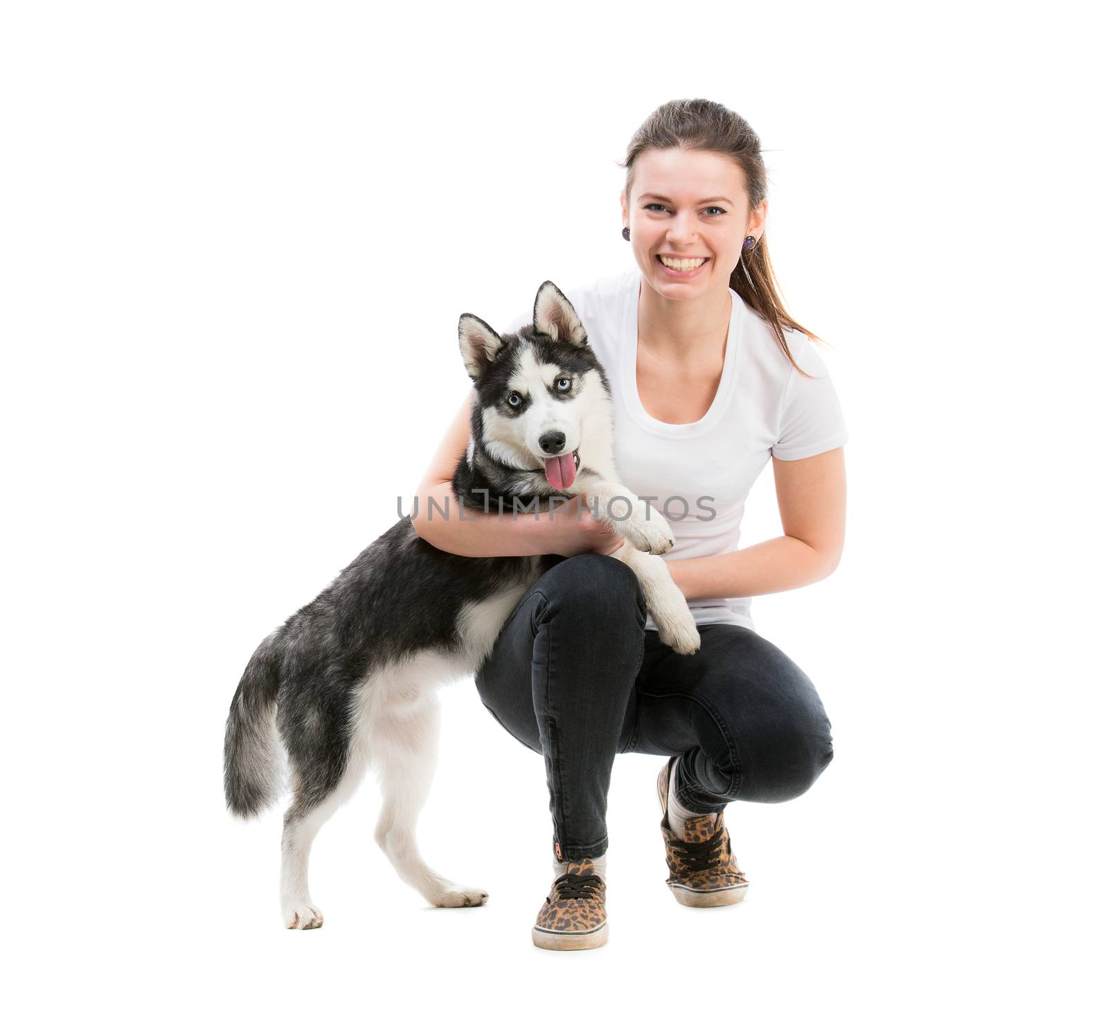 portrait of happy girl in white t-shirt isolated on white background and husky dog