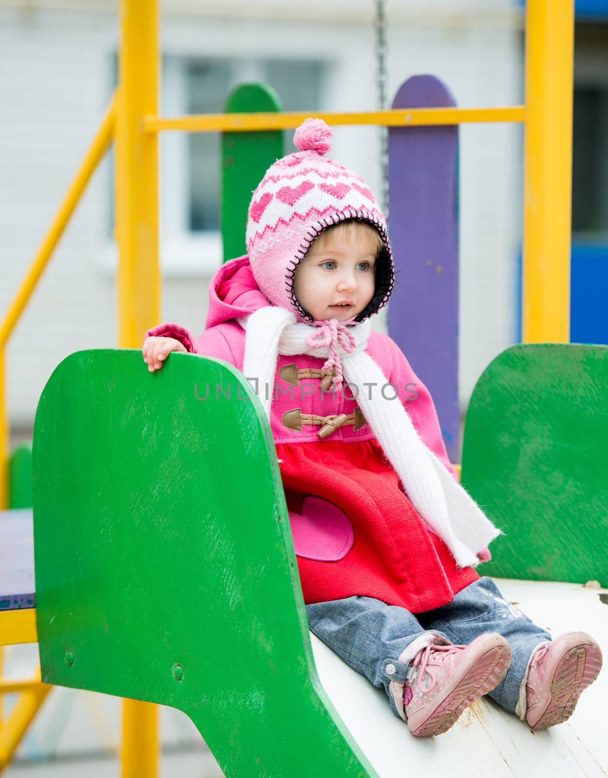 little girl playing on the playground