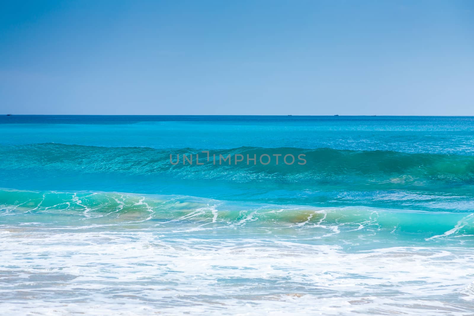 Beautiful surfing tropical sand beach on sunny summer day