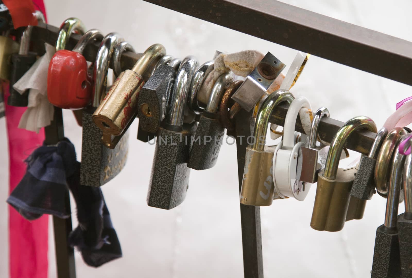 Wedding locks on the rail of a bridge