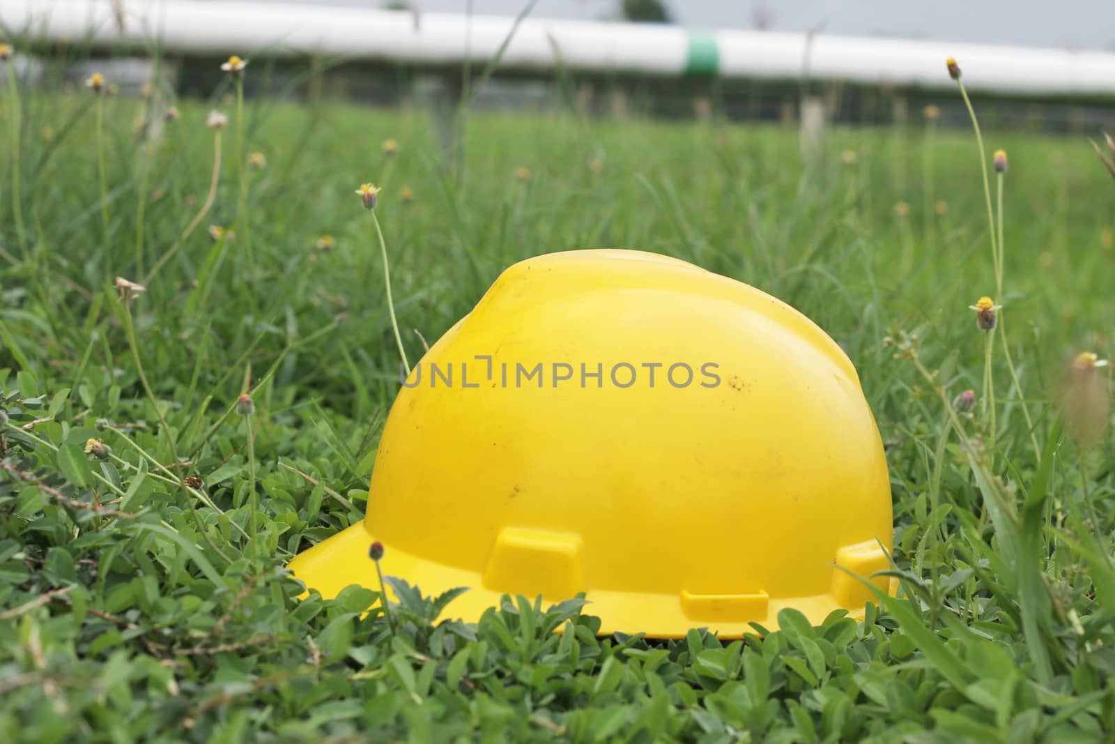 Yellow hard hat on hand wheel valve by ZONETEEn