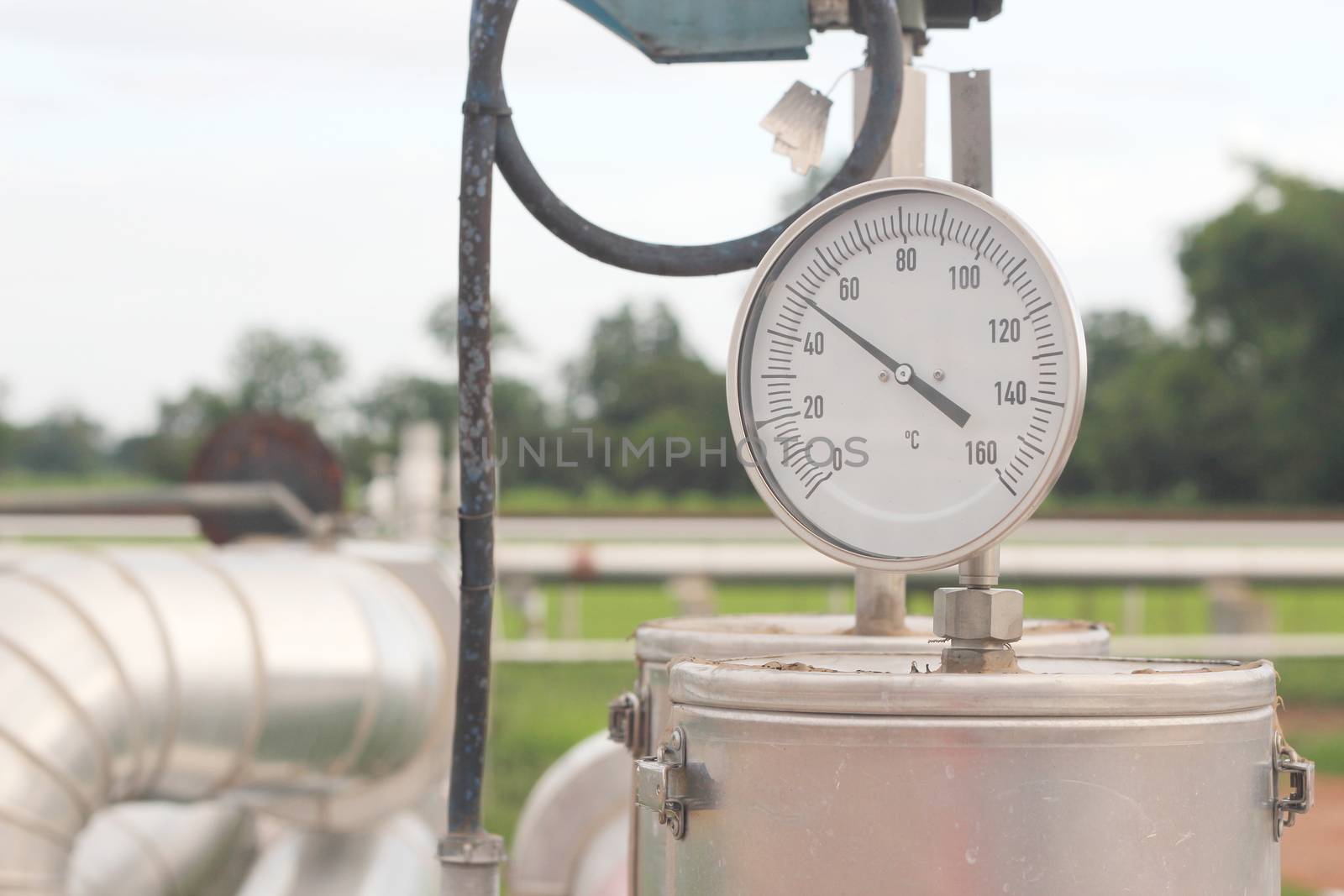 Closeup of a pressure meter on a machine by ZONETEEn