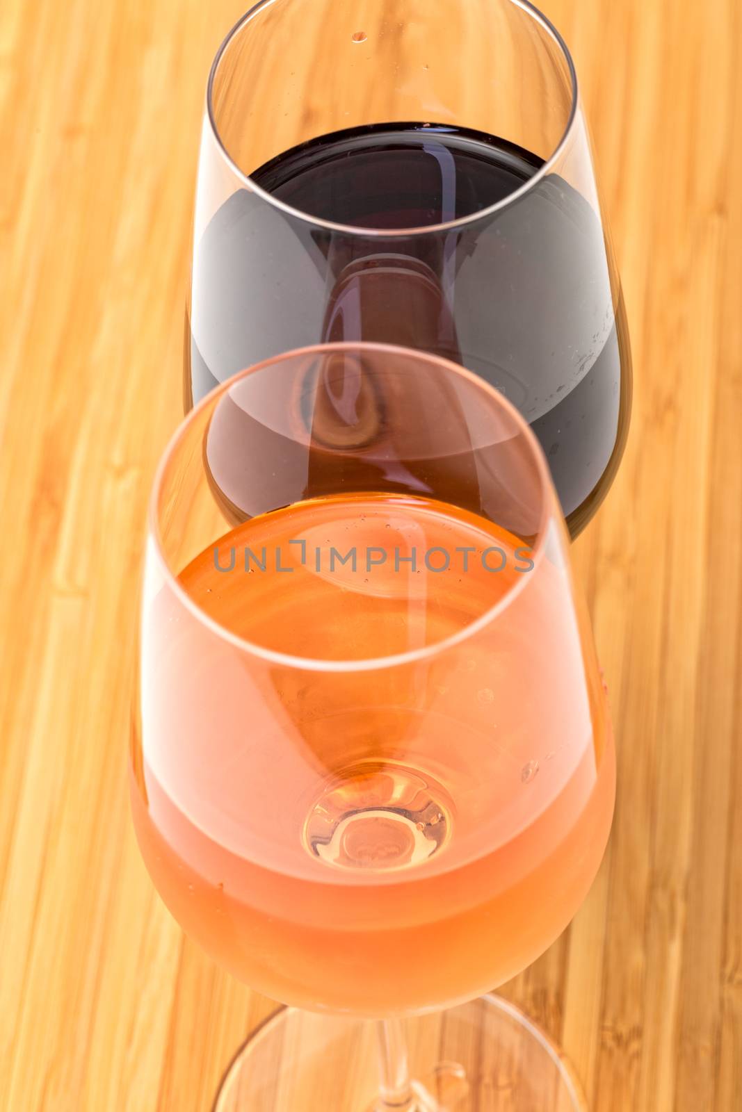 Glasses of Red and Pink Wine on Wooden Table, top view