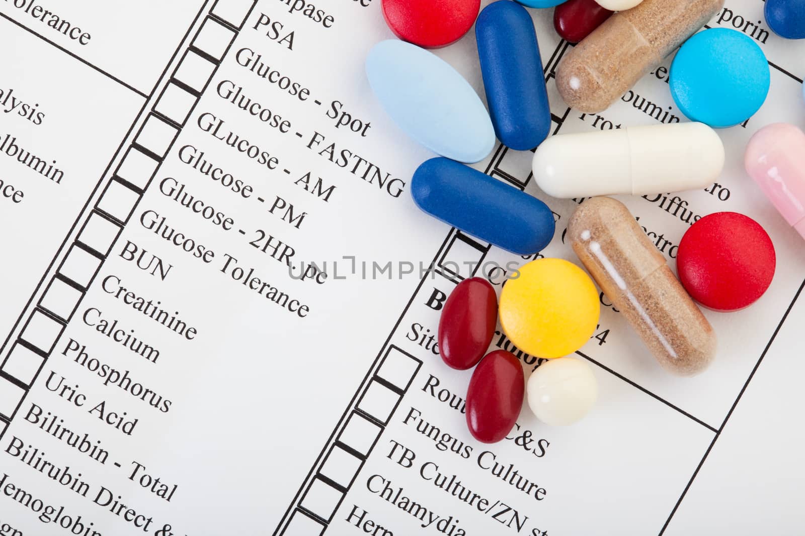 A variety of pills on a laboratory diagnostics form.