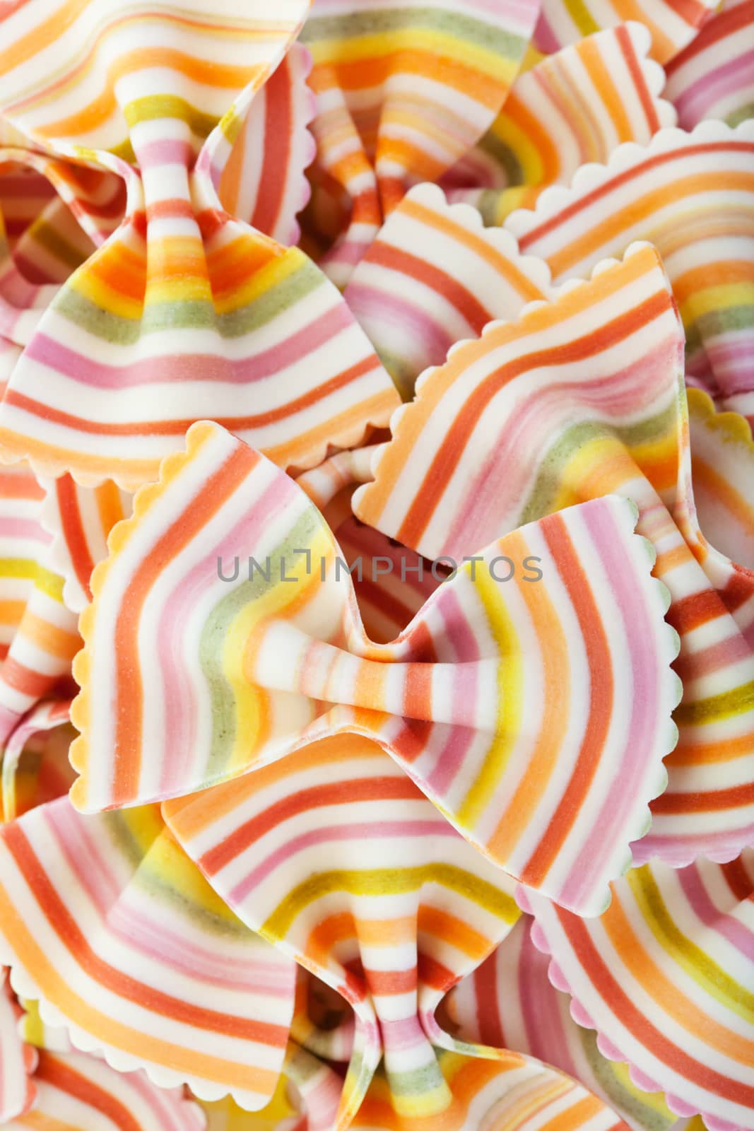 Fresh, gourmet bowtie dry pasta striped in a rainbow of colors.