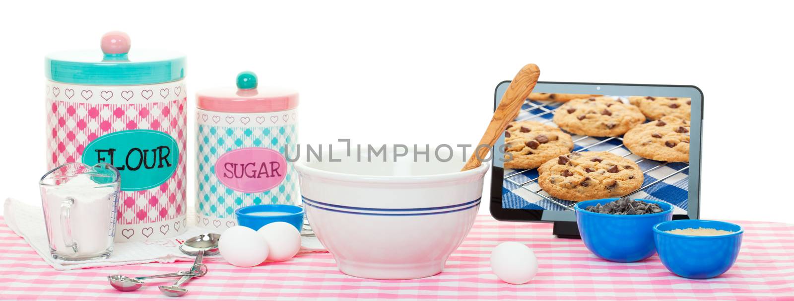 Baking using a tablet with recipe app & the internet.  Chocolate chip image on tablet is also available in my portfolio.