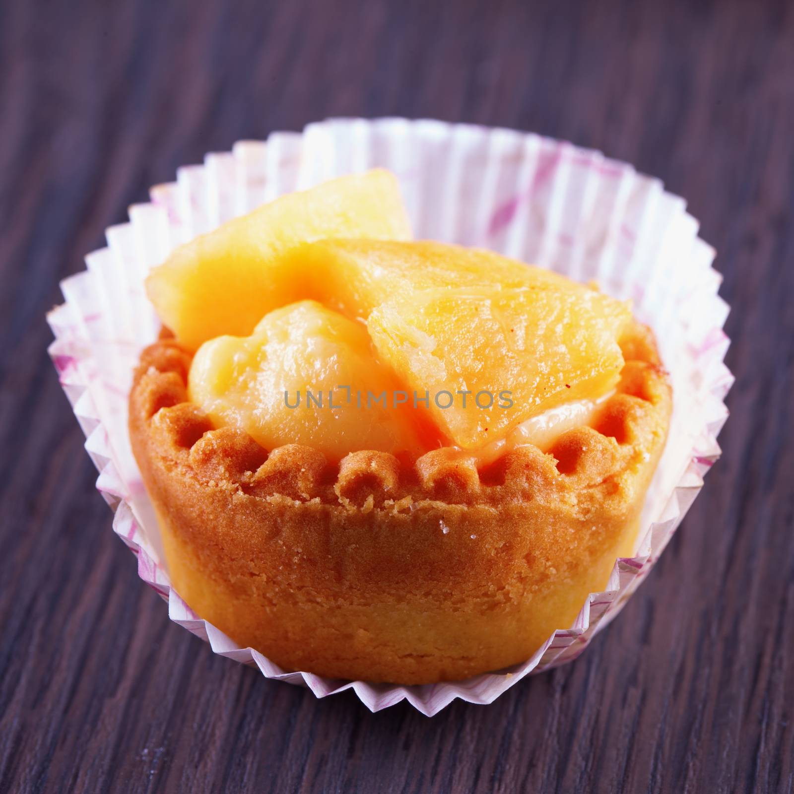 A small pastry over a wooden table