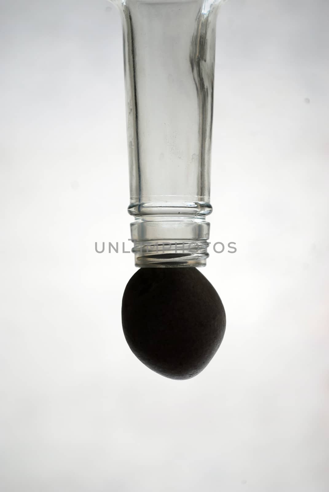 picture of glass bottle and stone