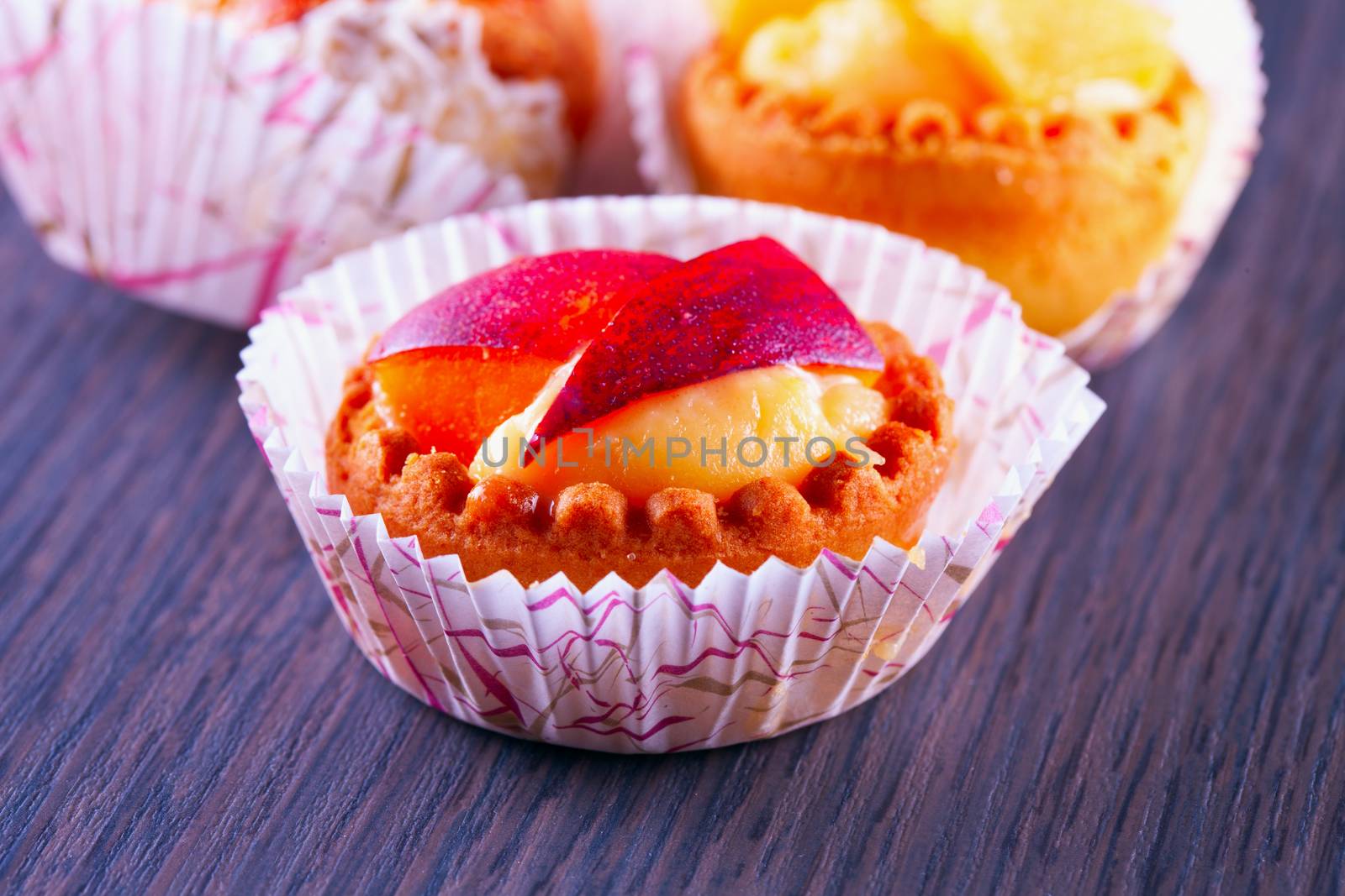 Small peach pastry over a wooden table