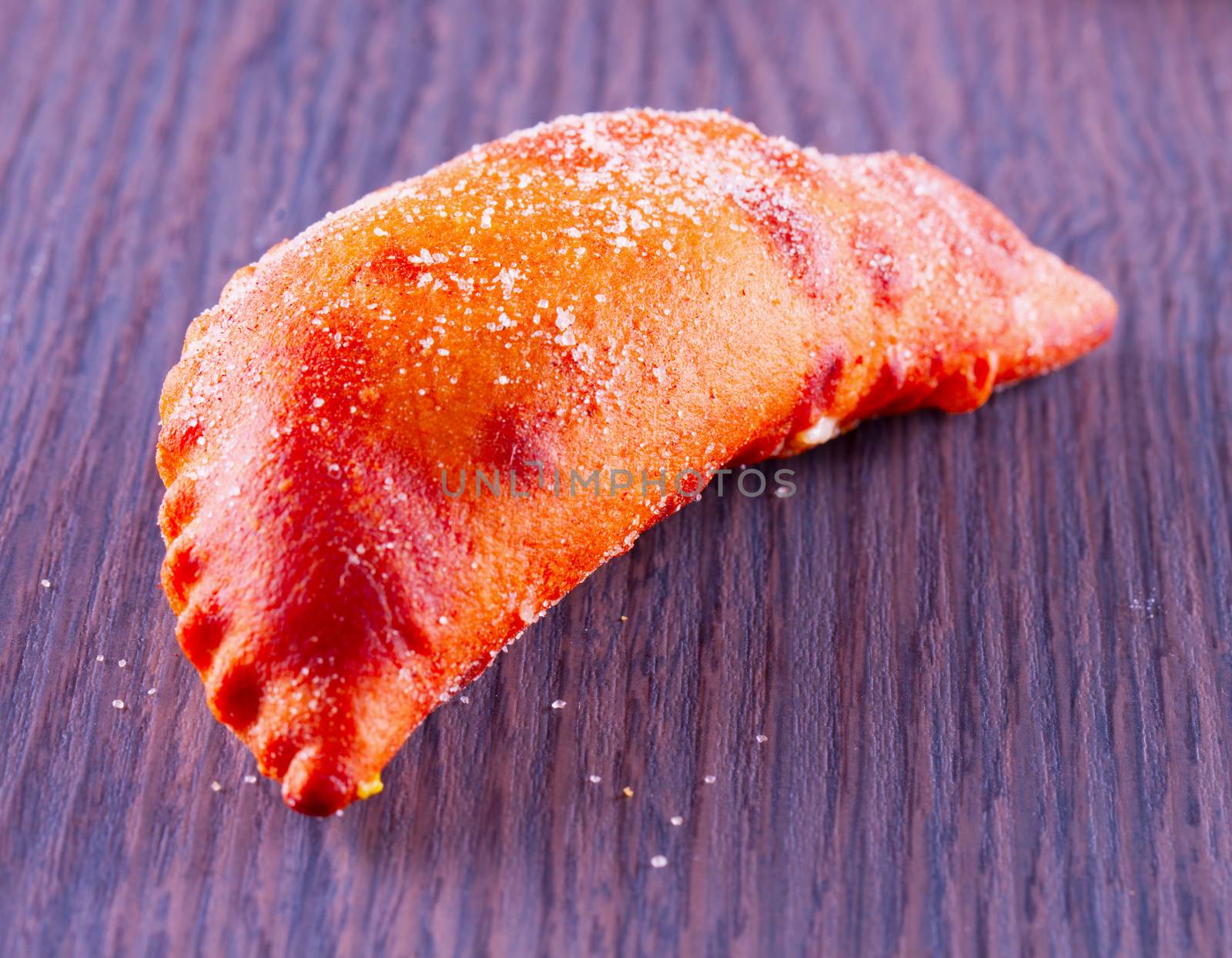 A small pastry over a wooden table