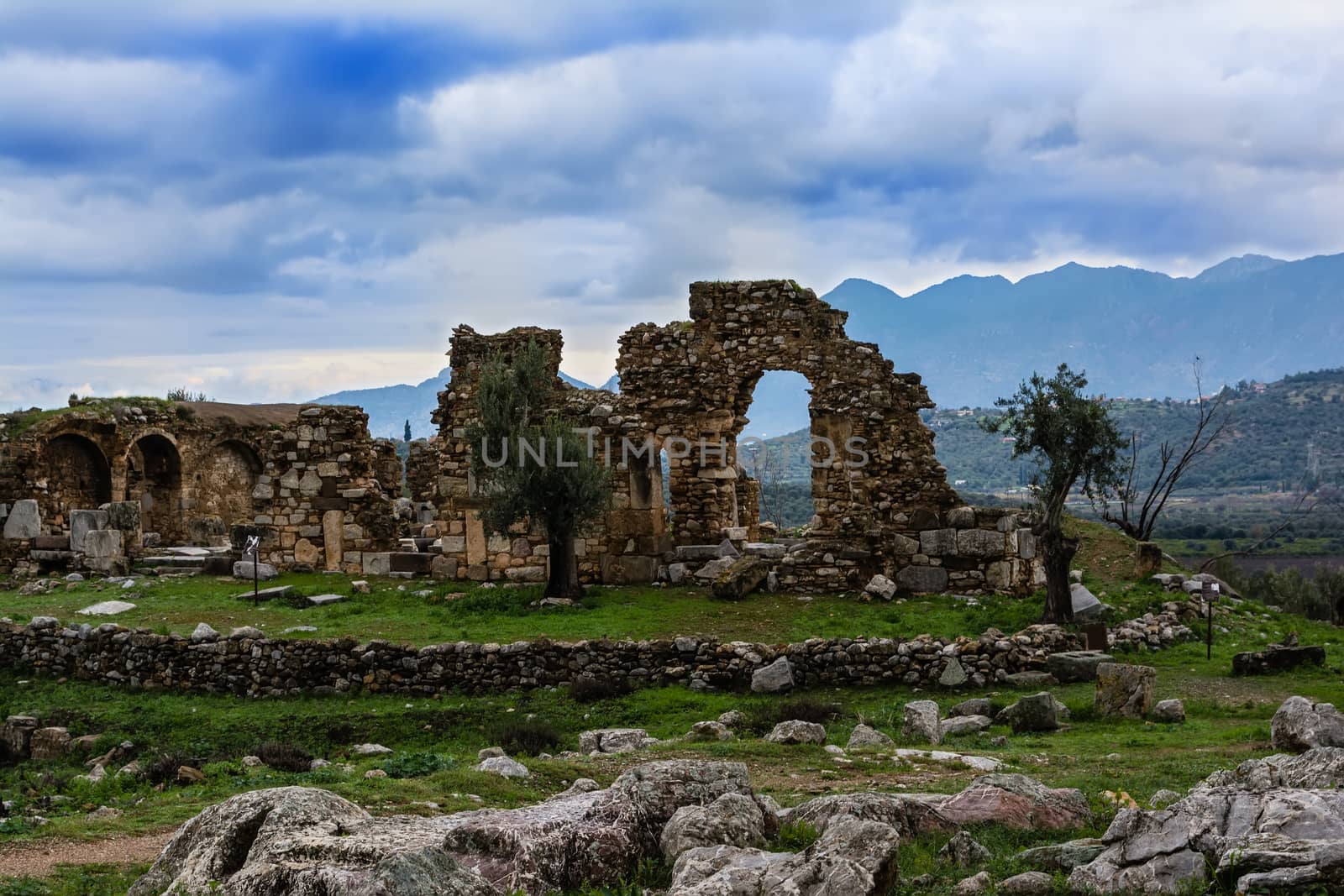 Pillar ruins at Ancient Troizina at dramatic sky, Peloponnese, Greece