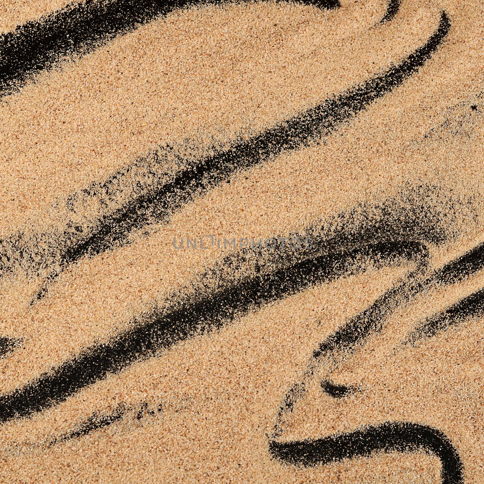 The sand on the black background close-up