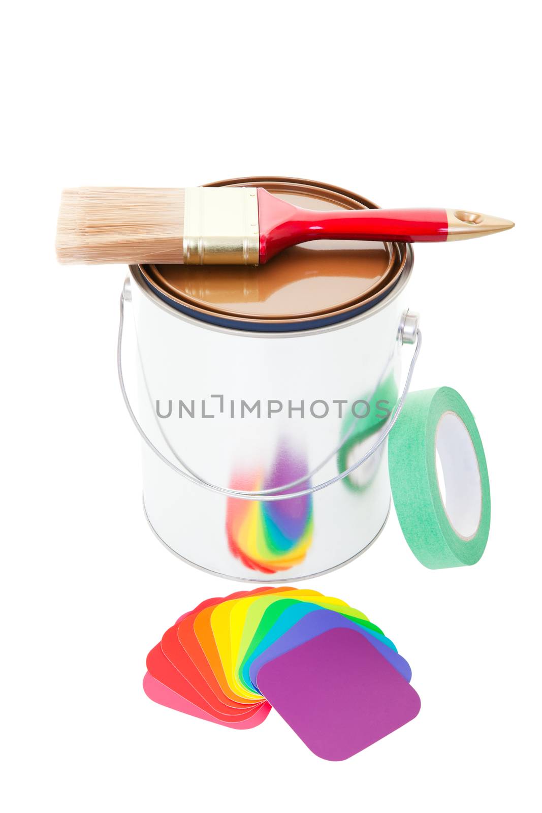 A paint can with a brush on top and painter's tape and an array of colorful paint chips beside.  Shot on white background.