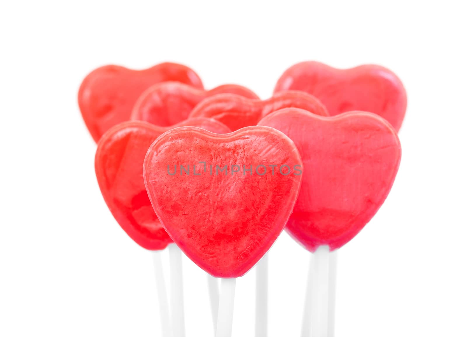 Red candy heart lollipops.  Shot on white background.
