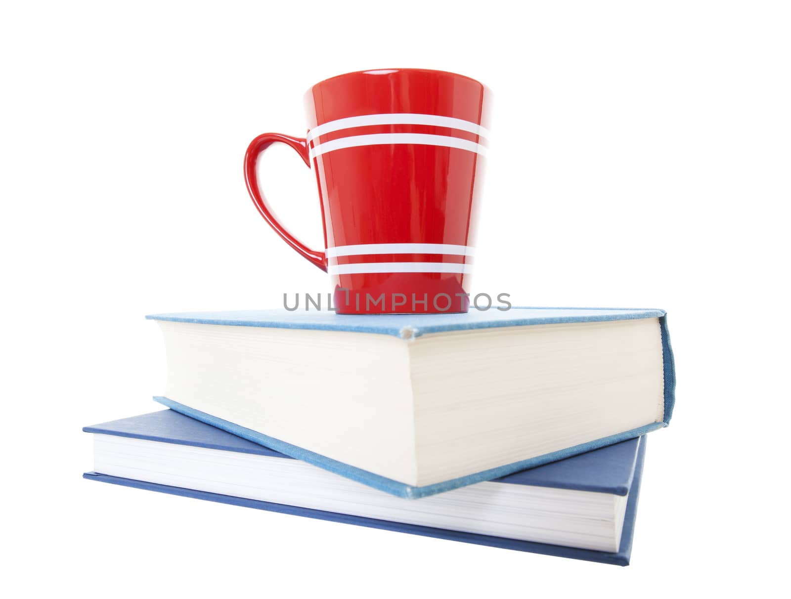 Everything needed for study time.  Textbooks and a cup of coffee on white background.  wide angle view.