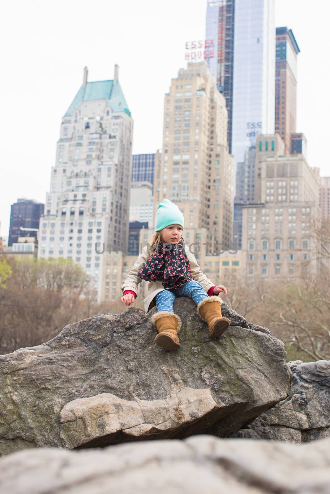 Adorable little girl in Central Park at New York City by travnikovstudio