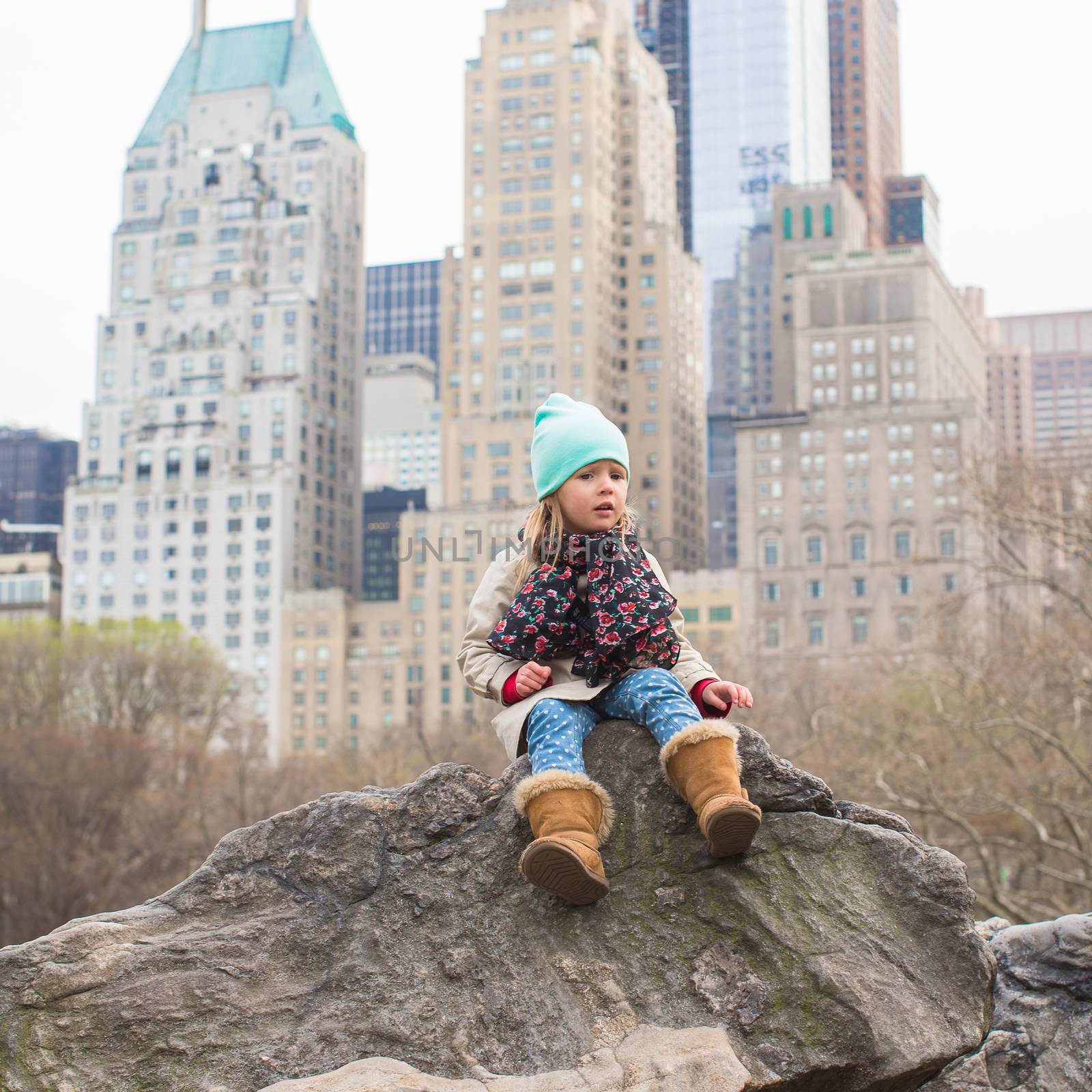 Adorable little girl in Central Park at New York City by travnikovstudio