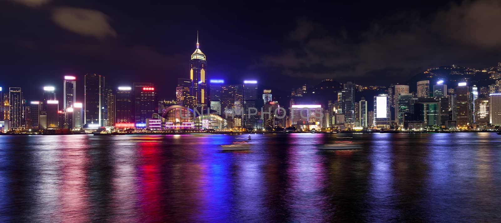 Hong Kong Island Central City Skyline Along Victoria Harbor at Night with Colorful Reflection Panorama