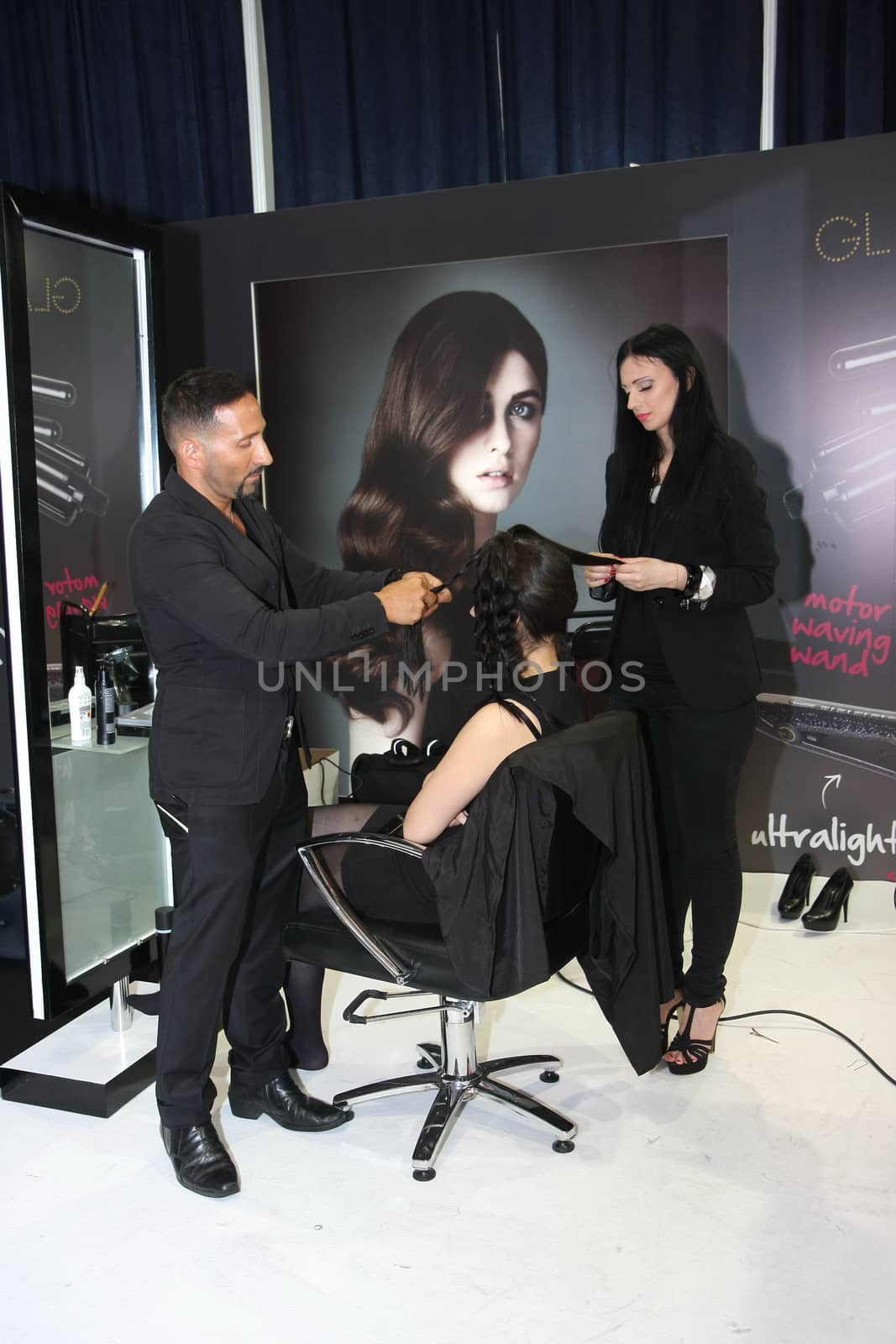 Model during hairdressing-styling  at 23th iinternational fair and congress of cosmetics, solarium, equipment, wellness, spa and hair care, the largest beauty fair in South-east Europe, The touch of Paris, 26th and 27th April 2014. Belgrade,Serbia