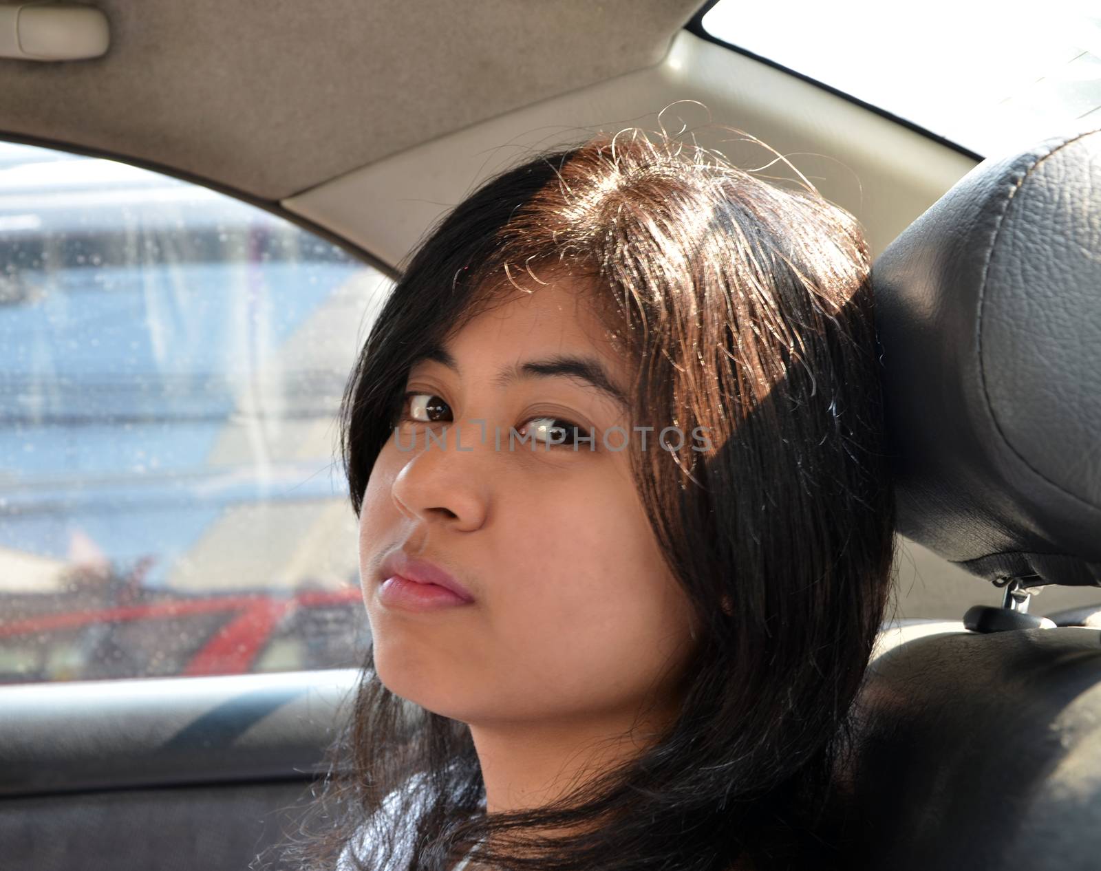 Pretty Asian Woman Sitting In Car 