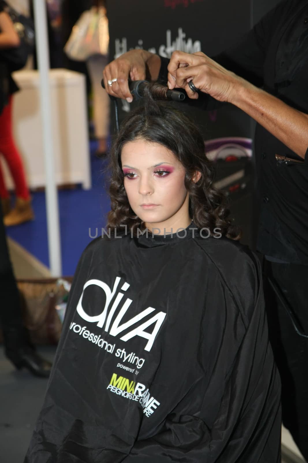 Model during hairdressing-styling  at 23th iinternational fair and congress of cosmetics, solarium, equipment, wellness, spa and hair care, the largest beauty fair in South-east Europe, The touch of Paris, 26th and 27th April 2014. Belgrade,Serbia