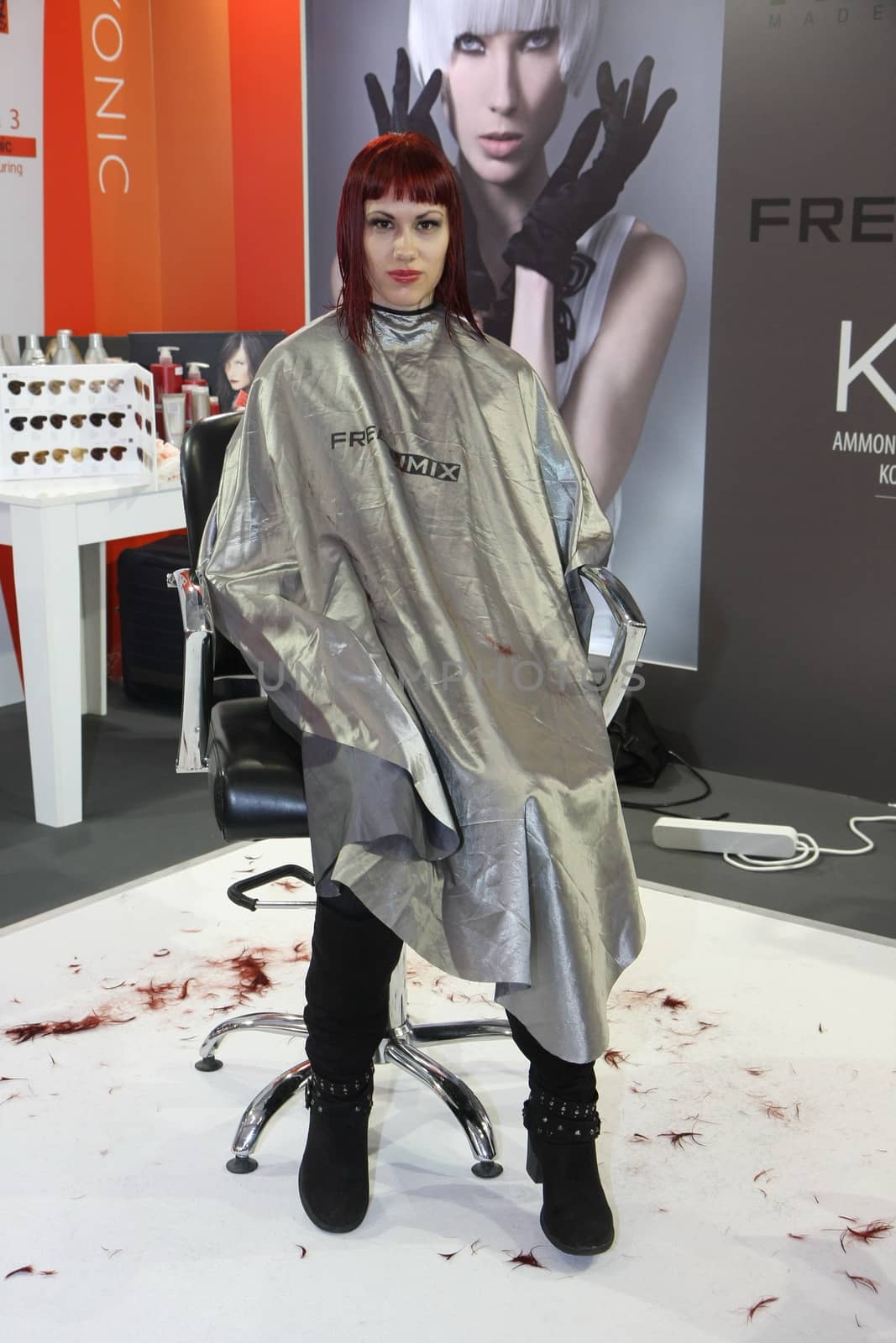 Model during hairdressing-styling  at 23th iinternational fair and congress of cosmetics, solarium, equipment, wellness, spa and hair care, the largest beauty fair in South-east Europe, The touch of Paris, 26th and 27th April 2014. Belgrade,Serbia