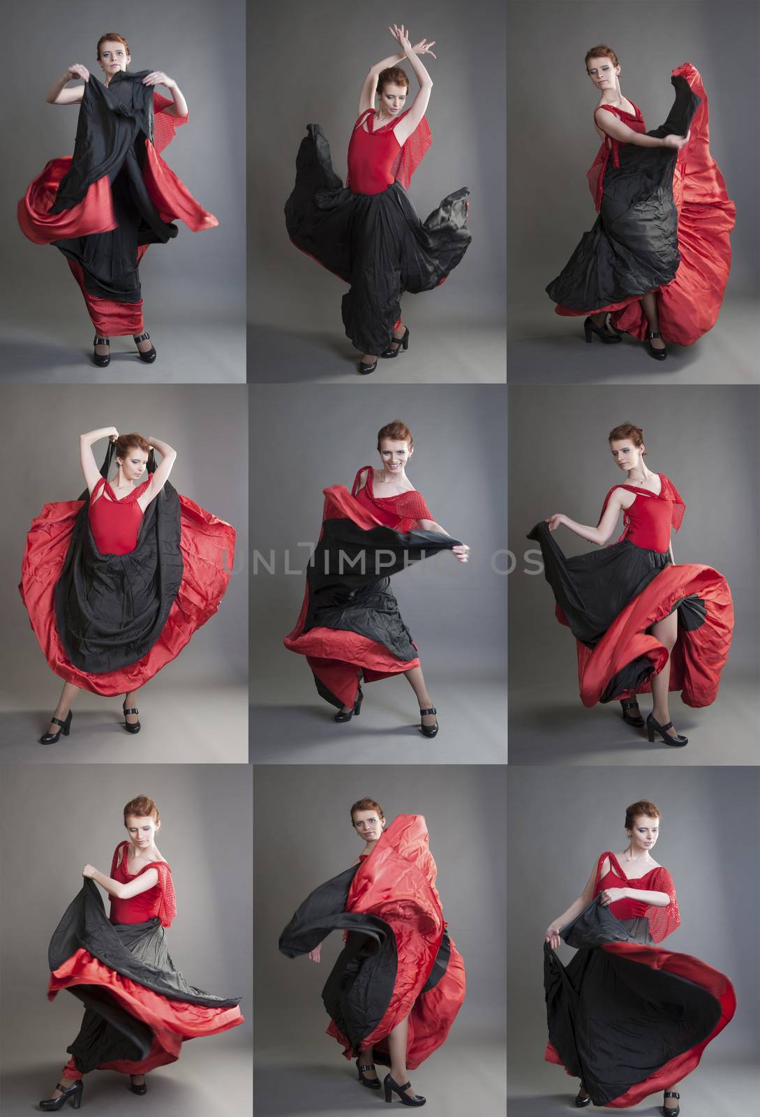 woman in the red dress dancing flamenco on a grey background