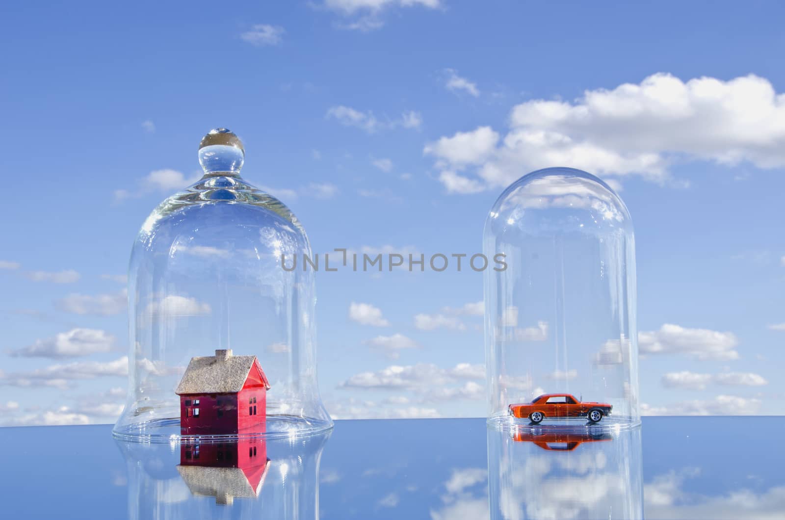 house and car toy symbols in glass bell on mirror. House concept