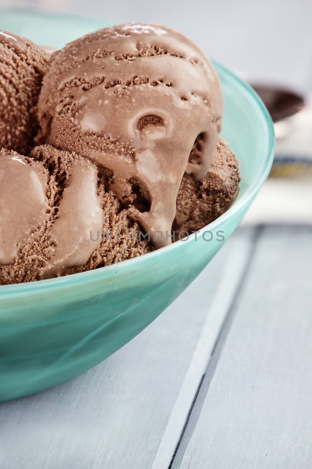 Bowl of rich chocolate ice cream with extreme shallow depth of field.