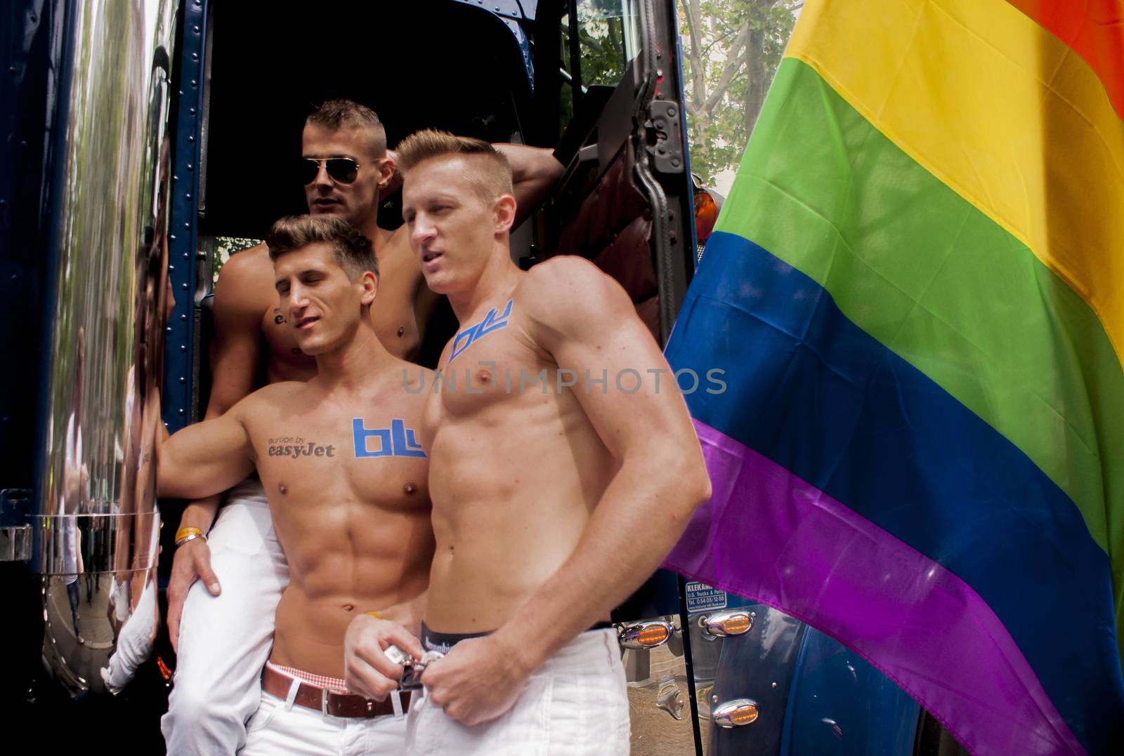 BERLIN, GERMANY - JUNE 21, 2014:Christopher Street Day.An unidentified participants at the gay pride, posing for pictures.  Crowd of people participate in the parade celebrates gays, lesbians, bisexuals and transgenders in Berlin.