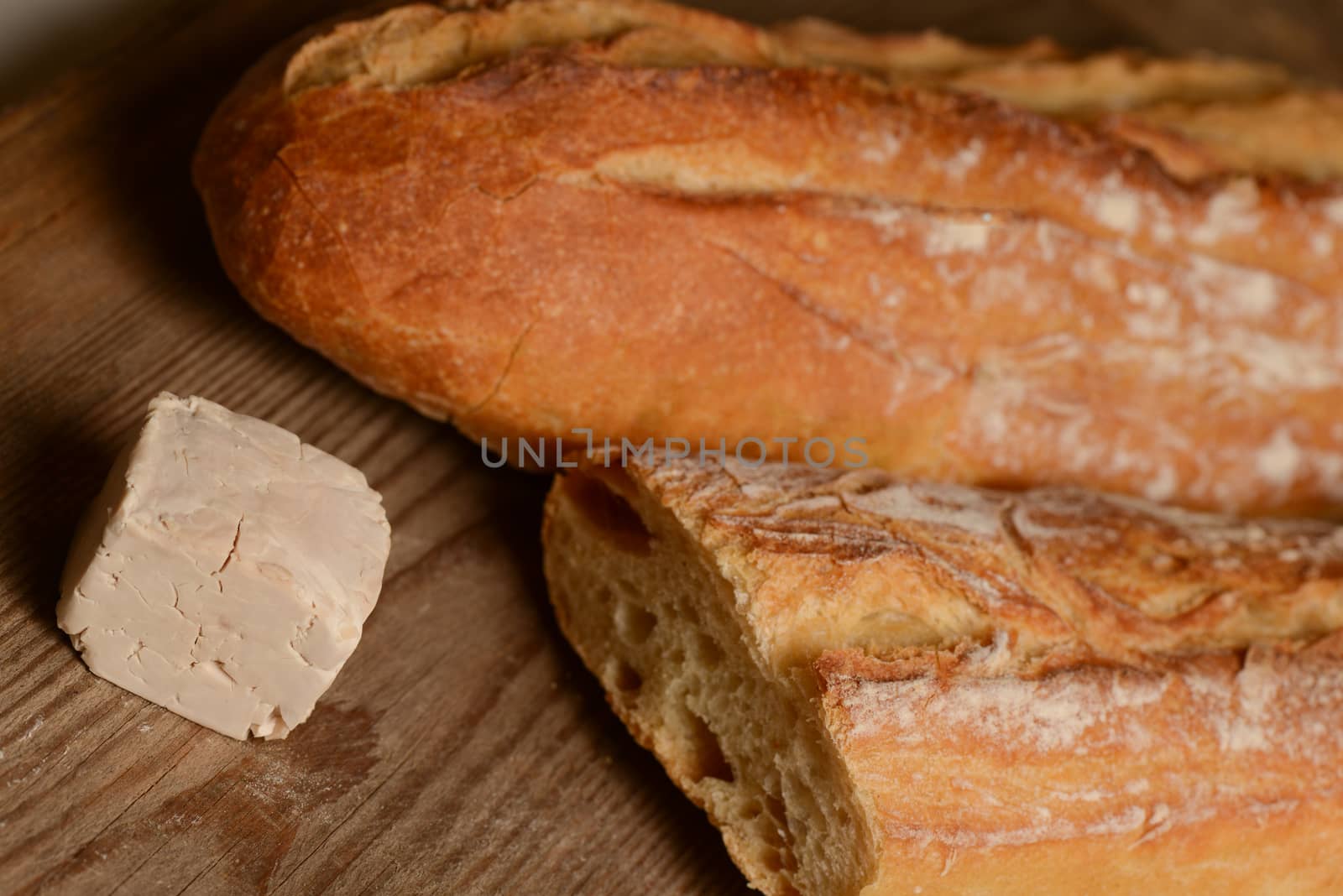 Yeast and bread on wood