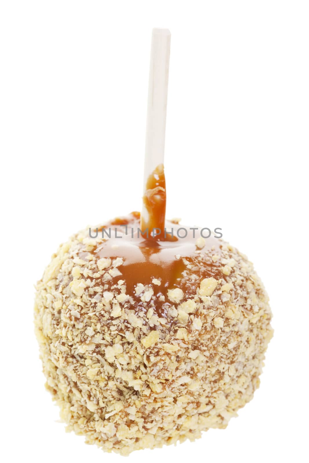 Caramel covered candy apple rolled in crush peanut.  Shot on white background.