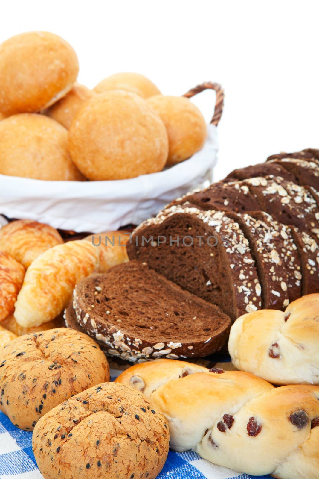 An arrangement of different kinds of breads and buns. 