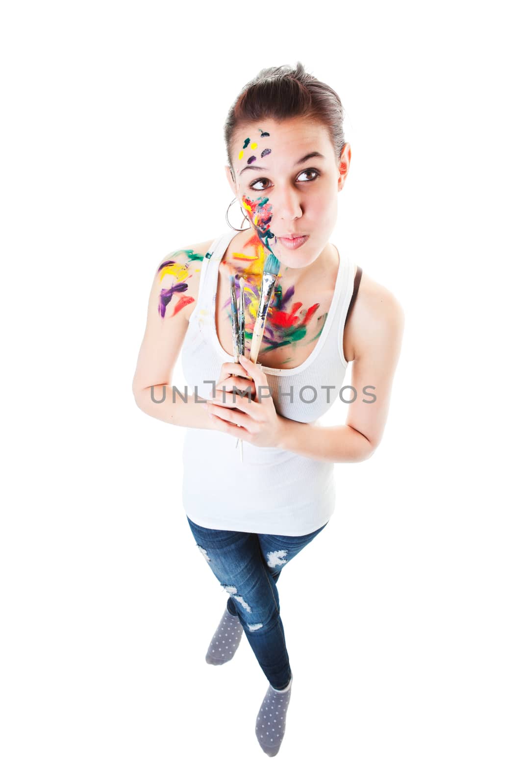 An artist thinking about her next work of art.  Shot on white background. Wide angle view.