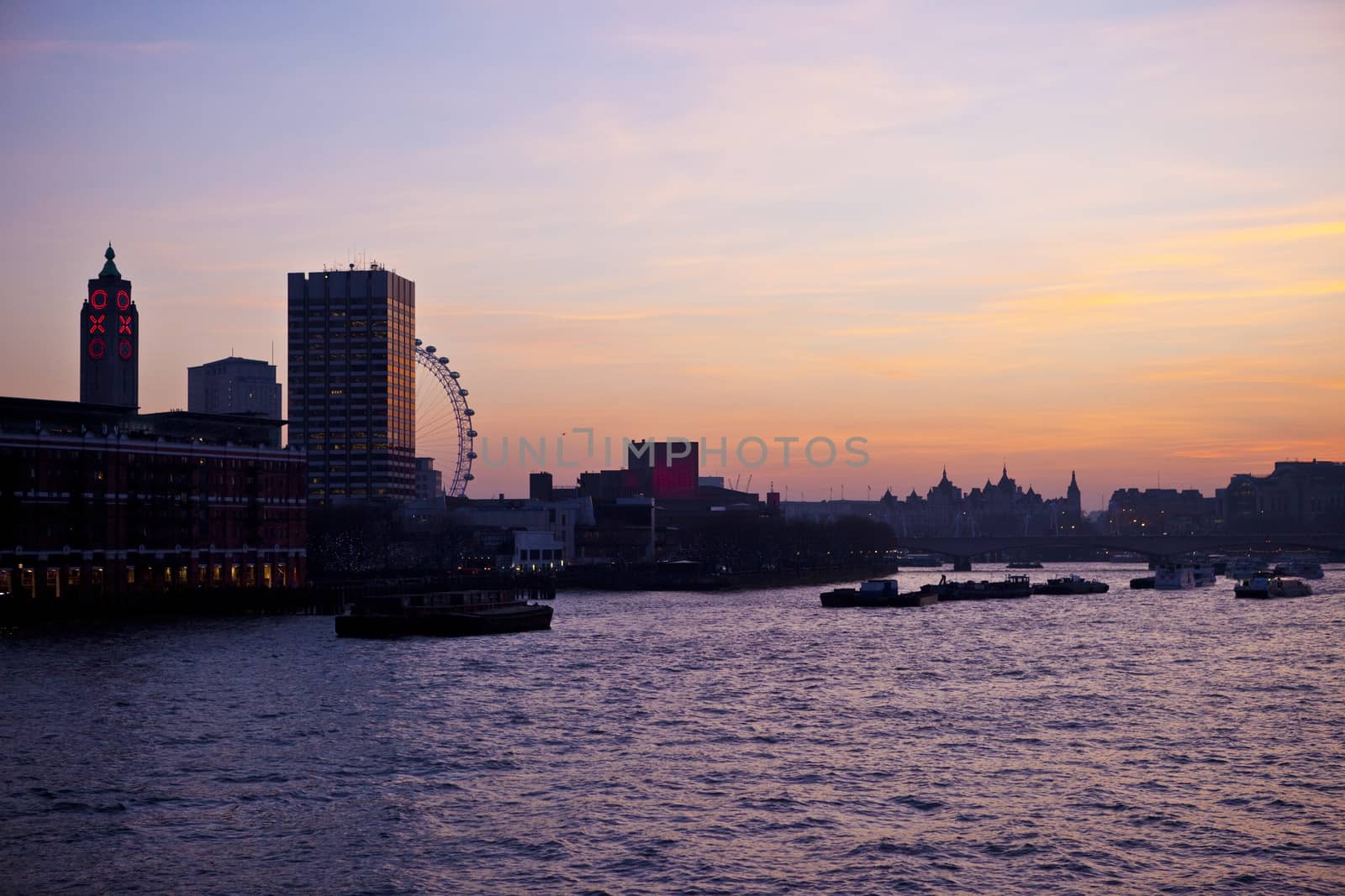 A beautiful sunset in London taking in the River Thames, London Eye and Oxo Tower.