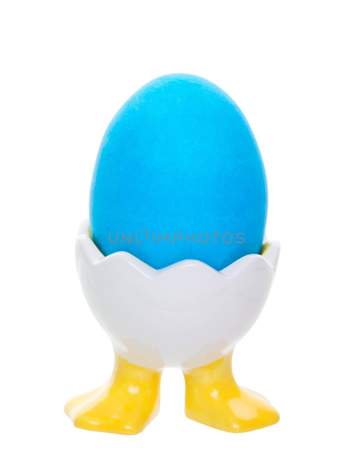 Bright blue Easter egg in an easter egg cup with duck feet. Shot on white background.