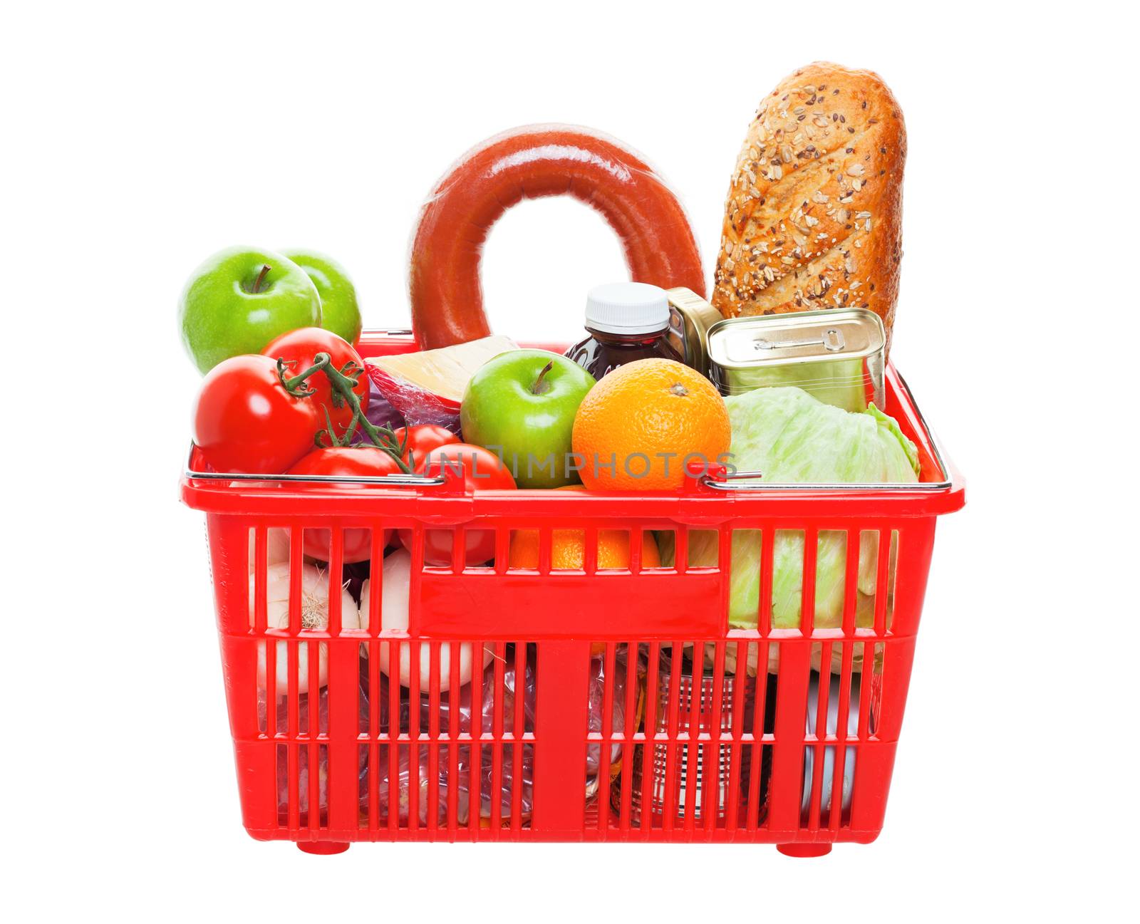A grocery basket filled with fresh fruits, vegetables, sausage, bread, and canned goods.  Shot on white background.