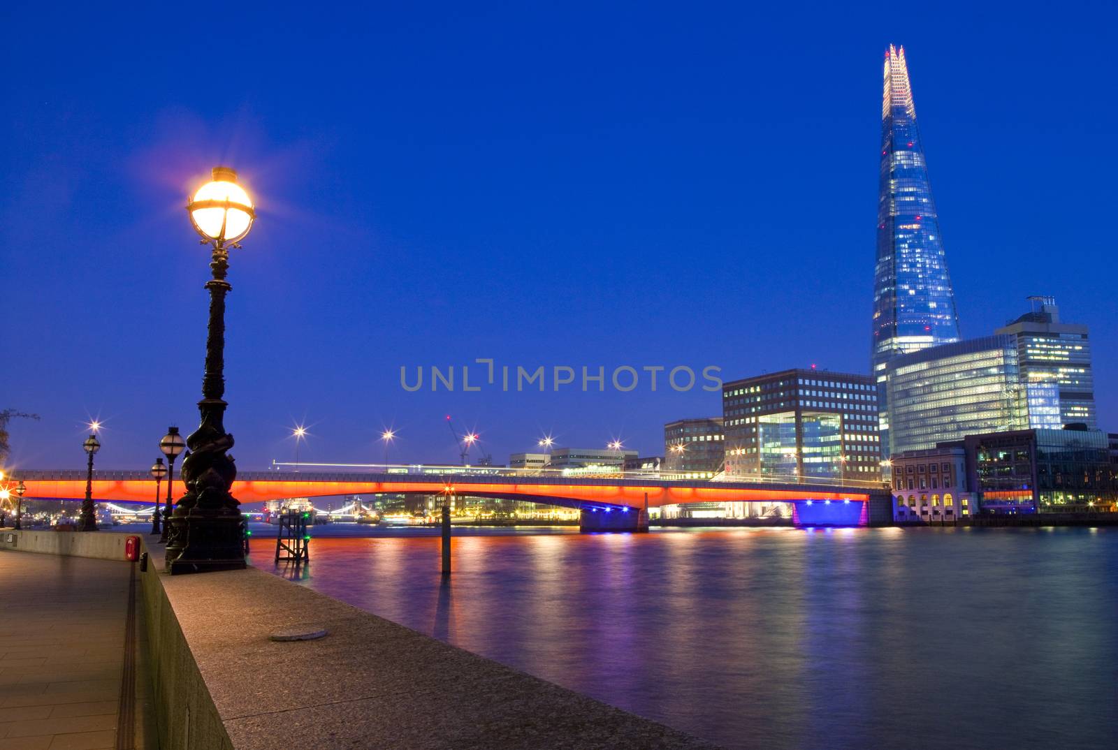 The Shard and London Bridge spanning over the River Thames.