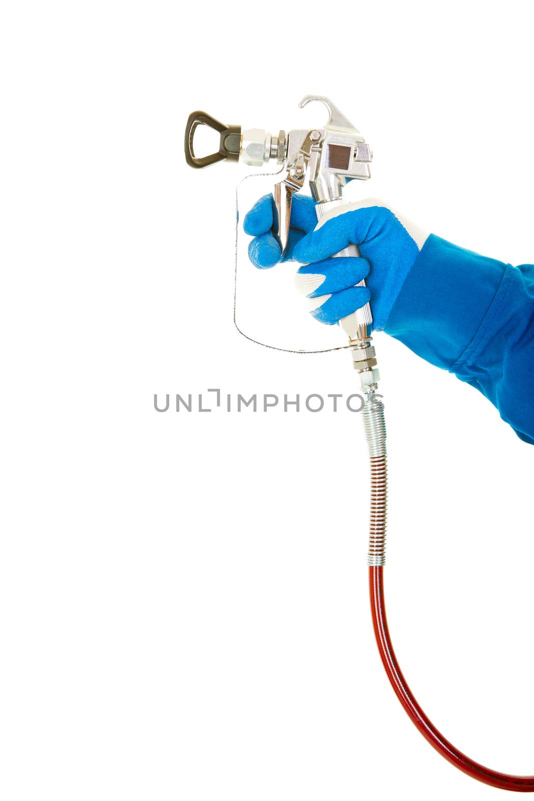 A painter's arm and hand in safety coveralls and gloves holding an Industrial size airless spray gun used for industrial painting and coating.  Shot on white background.