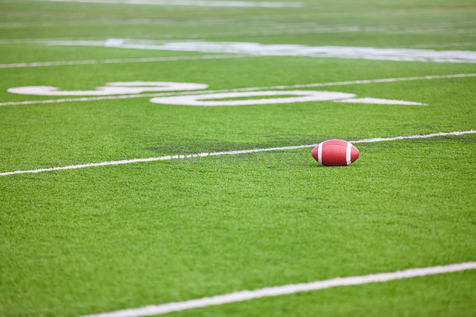 Football on Stadium Field by songbird839