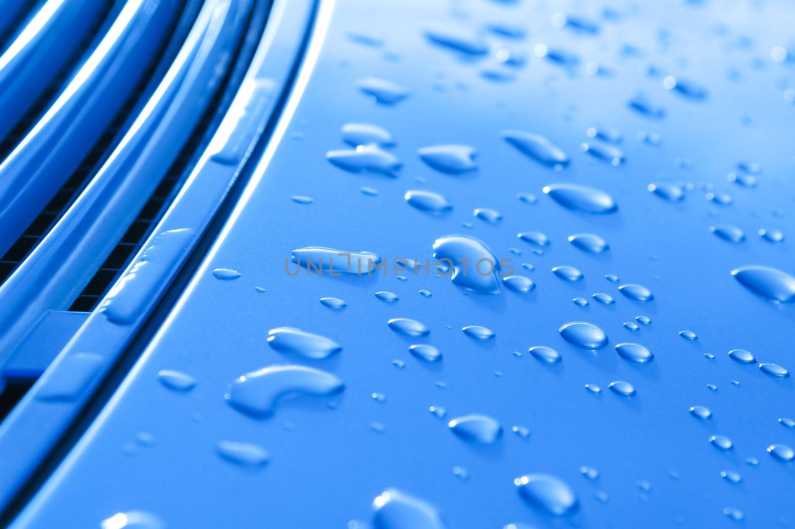 raindrops on a blue metal vehicle panel