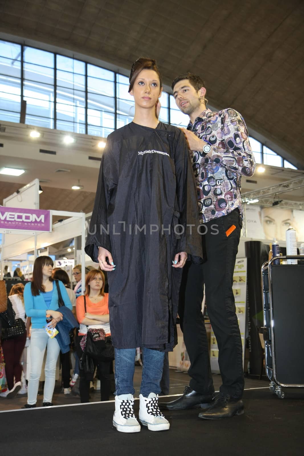 Model during hairdressing-styling  at 23th iinternational fair and congress of cosmetics, solarium, equipment, wellness, spa and hair care, the largest beauty fair in South-east Europe, The touch of Paris, 26th and 27th April 2014. Belgrade,Serbia